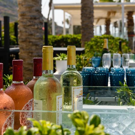 Minos Imperial Luxury Beach Resort & Spa Milatos Esterno foto Wine at a poolside bar