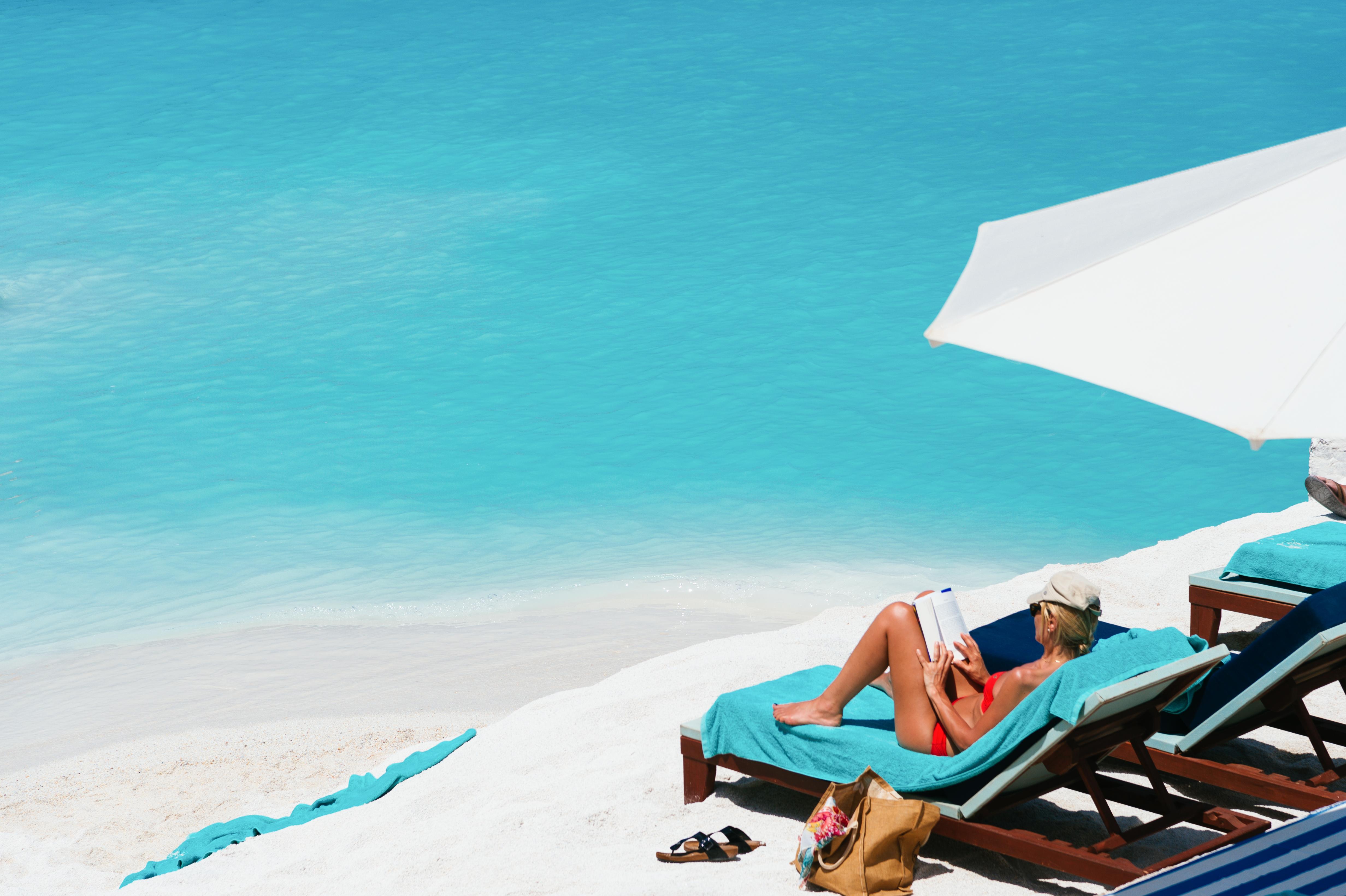 Minos Imperial Luxury Beach Resort & Spa Milatos Esterno foto A woman sunbathing on a beach